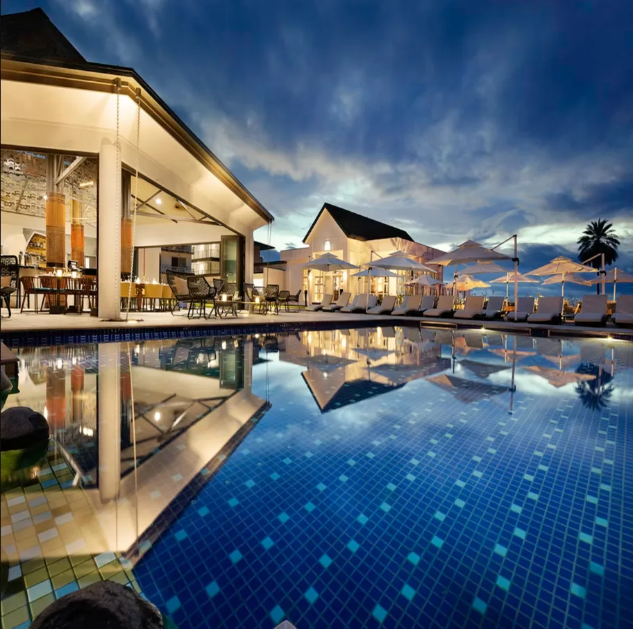Tropical resort with pool and palm trees