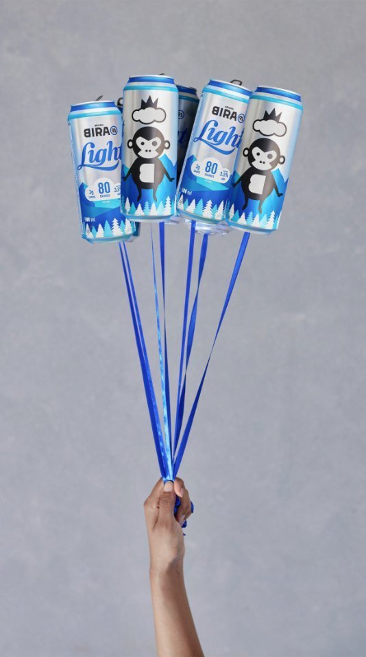 Bira 91 Light cans tied to blue ribbons like balloons