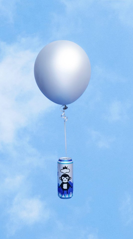 Bira 91 Light can suspended from a white balloon in sky