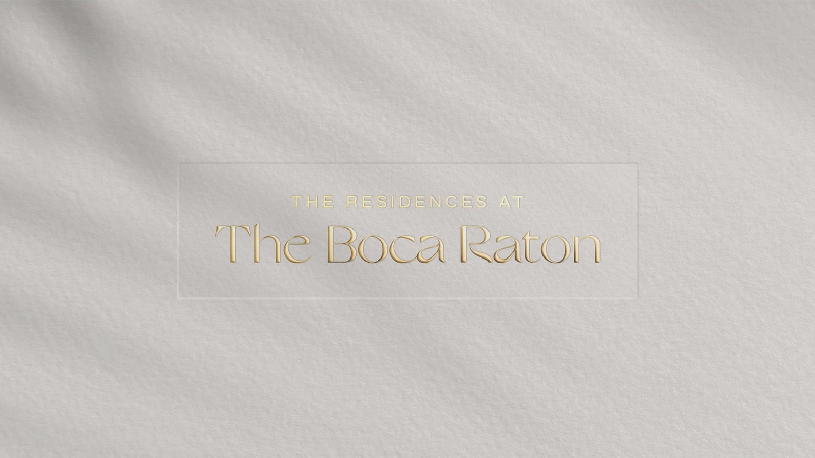 The Residences at The Boca Raton wordmark, blind embossed in gold on ivory