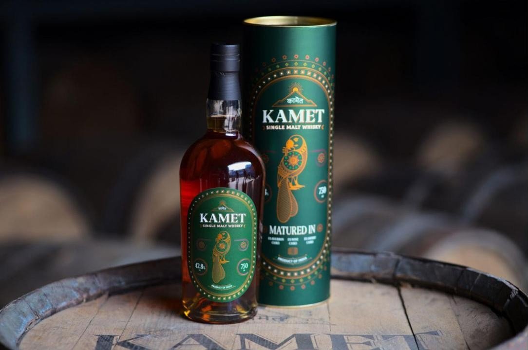 Kamet bottle alongside gift canister