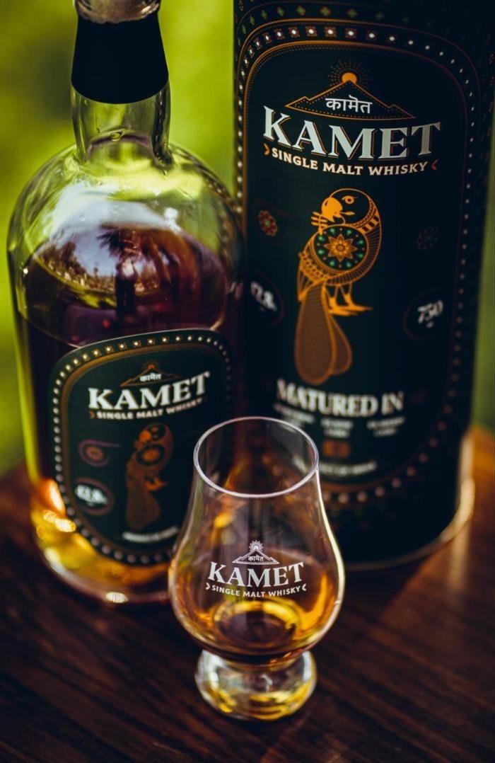 Kamet bottle, parrot motif detail in copper on green