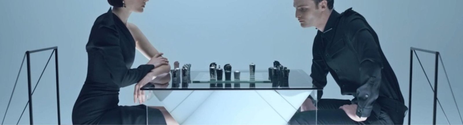 MIND GAMES chess scene with sculptural fragrance bottles