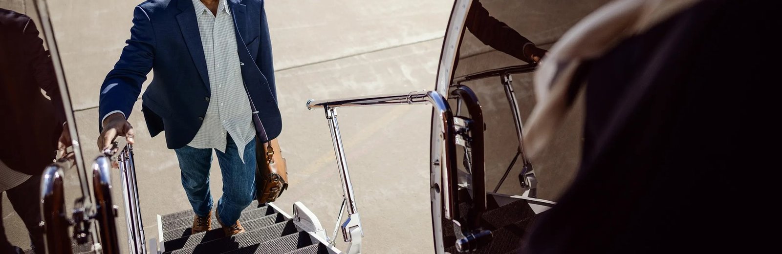 Pentastar Aviation client boarding a private jet