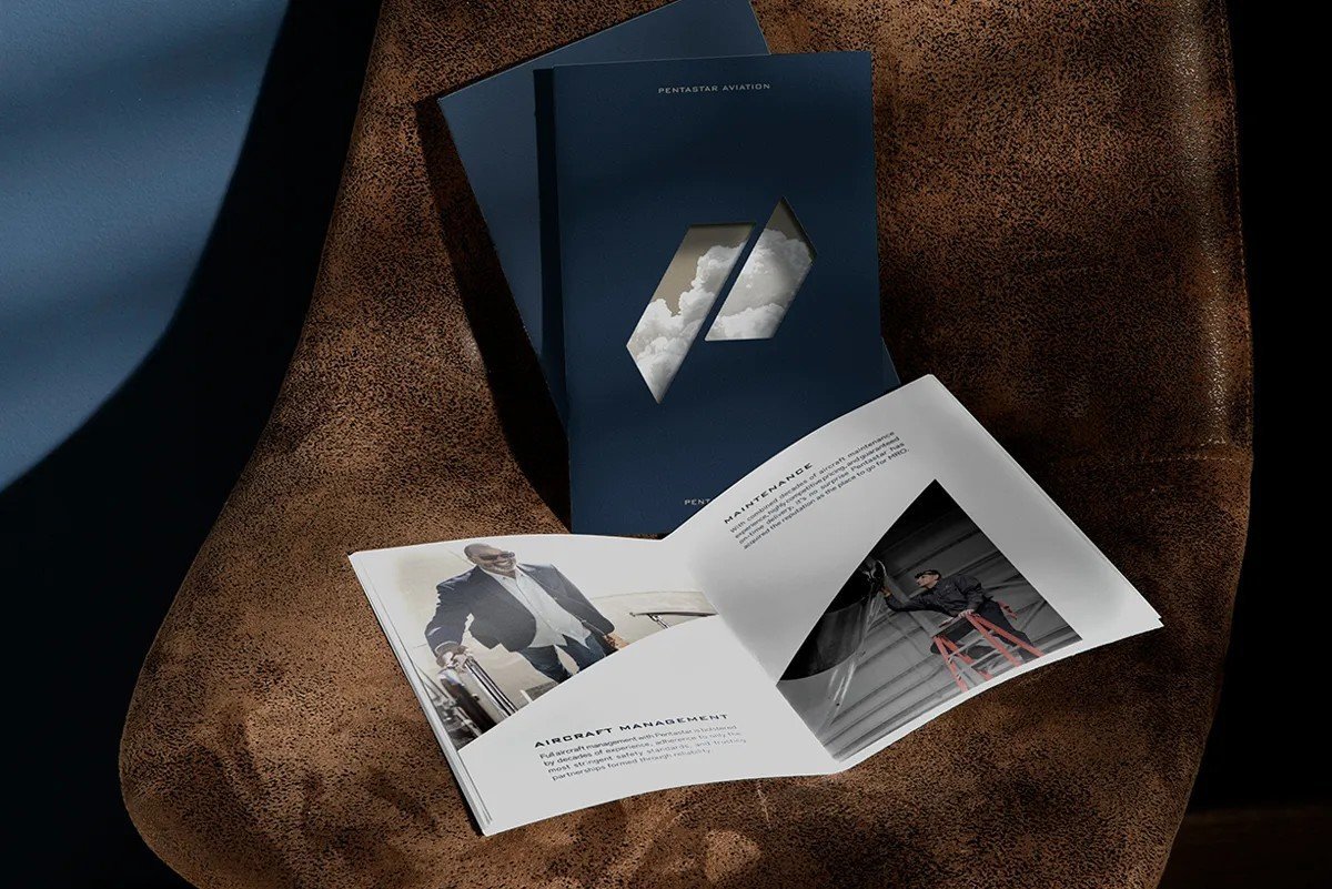 Pentastar brochure spread on leather surface