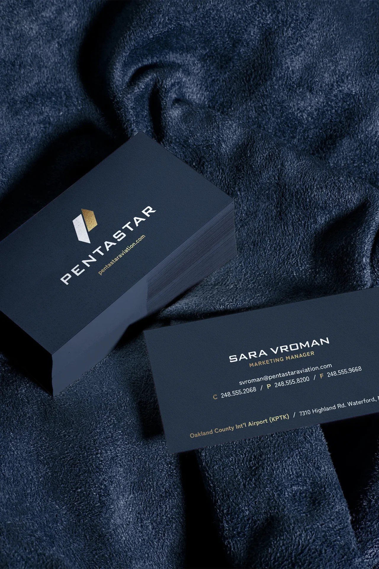 Pentastar business card detail on brushed navy stock