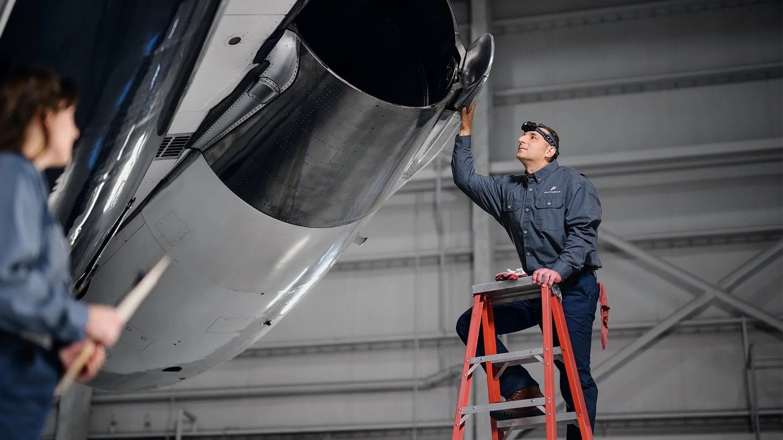 Pentastar engineer inspecting the engine