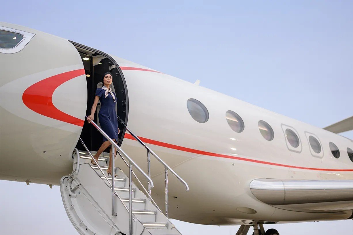 Pentastar flight attendant stepping off the jet